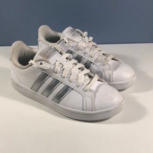White Adidas with silver stripes, US Women’s 6